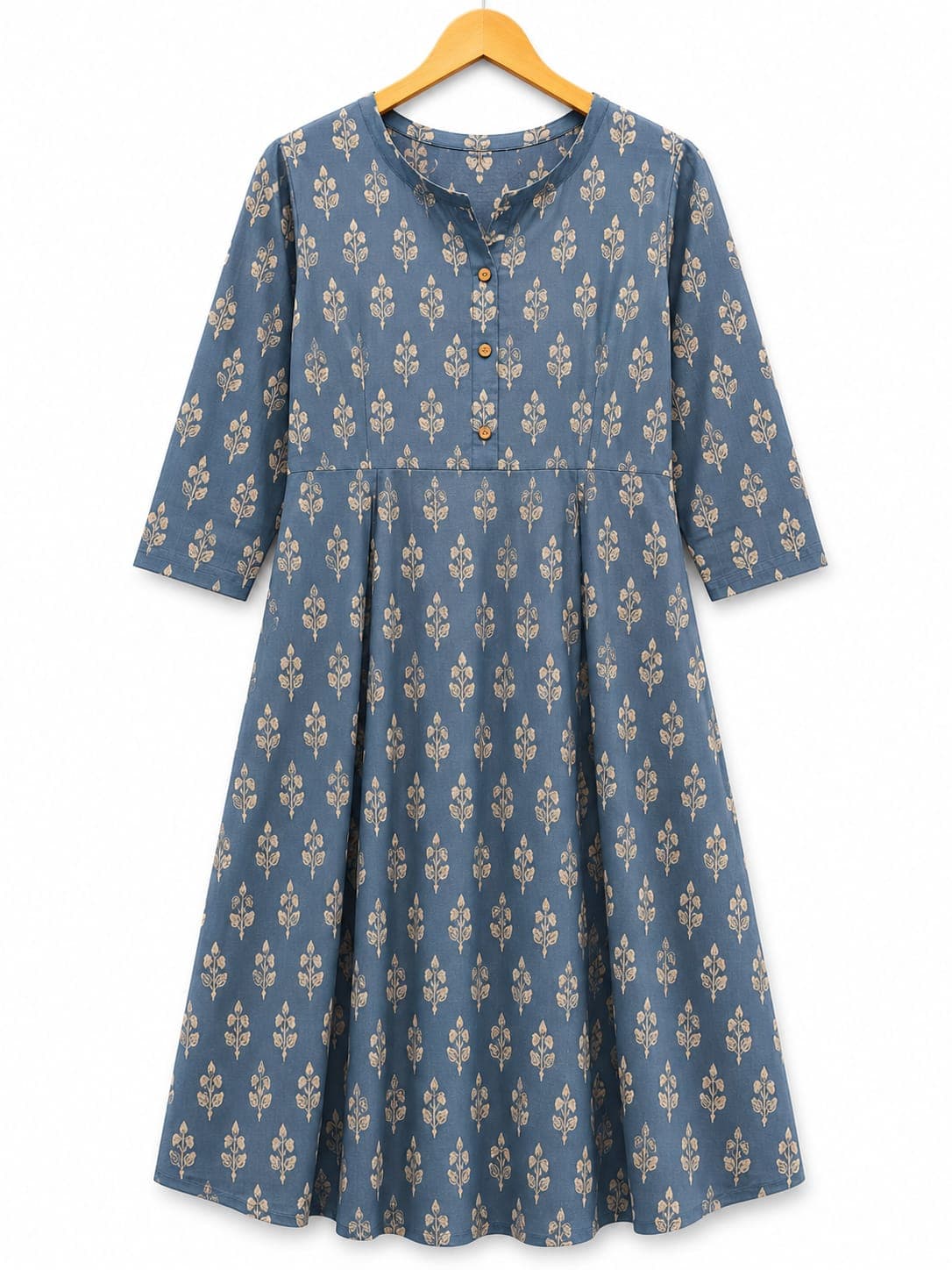 Dusty blue floral dress on a wooden hanger